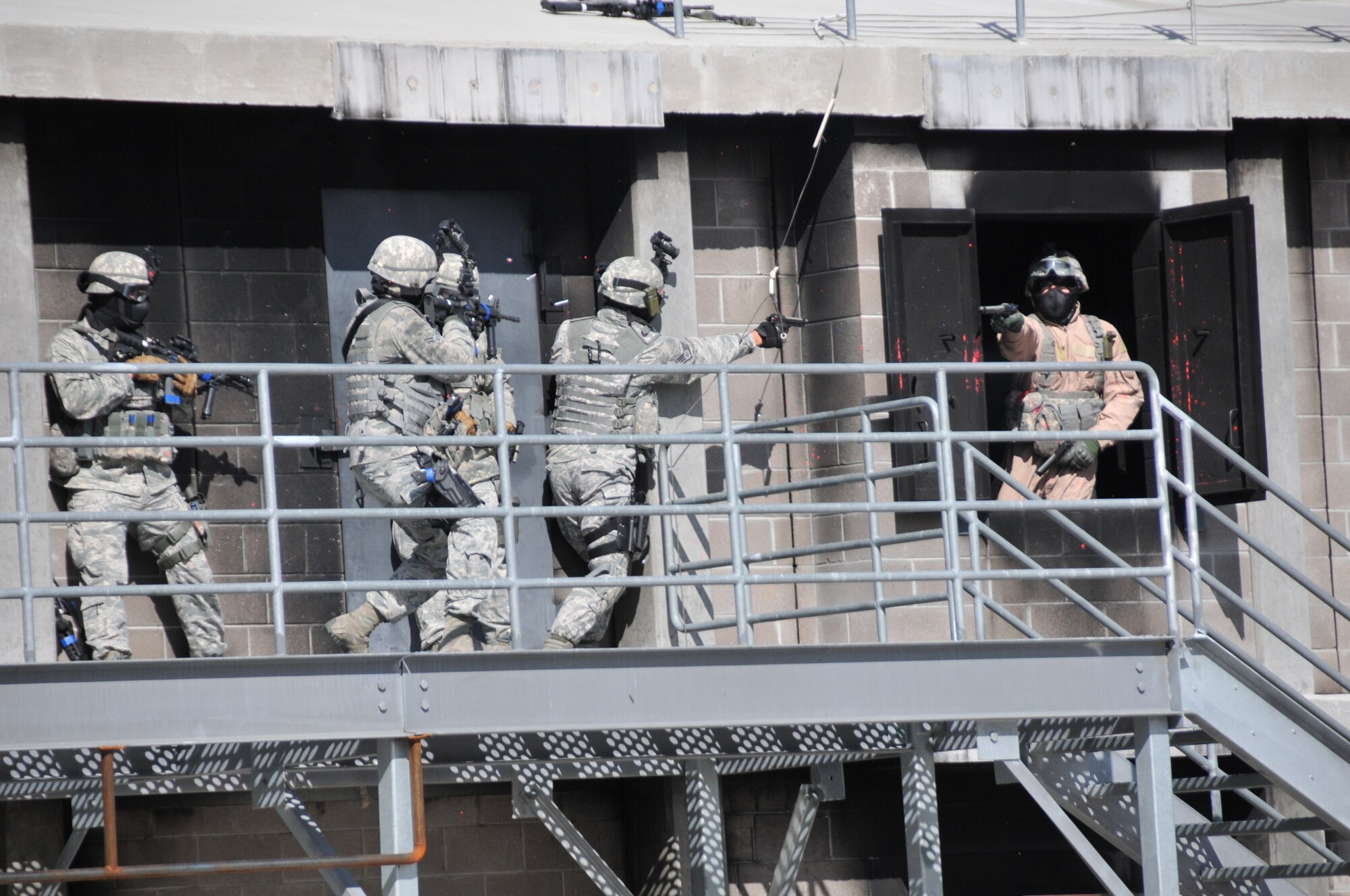 Members of the 153rd Security Forces Squadron participate in an active shooter training exercise Oct. 13, 2012. Training was part of the squadrons annual training program designed to prepare the SFS members for active shooter situations. (U.S. Air Force photo by Airman 1st Class Nichole Grady)