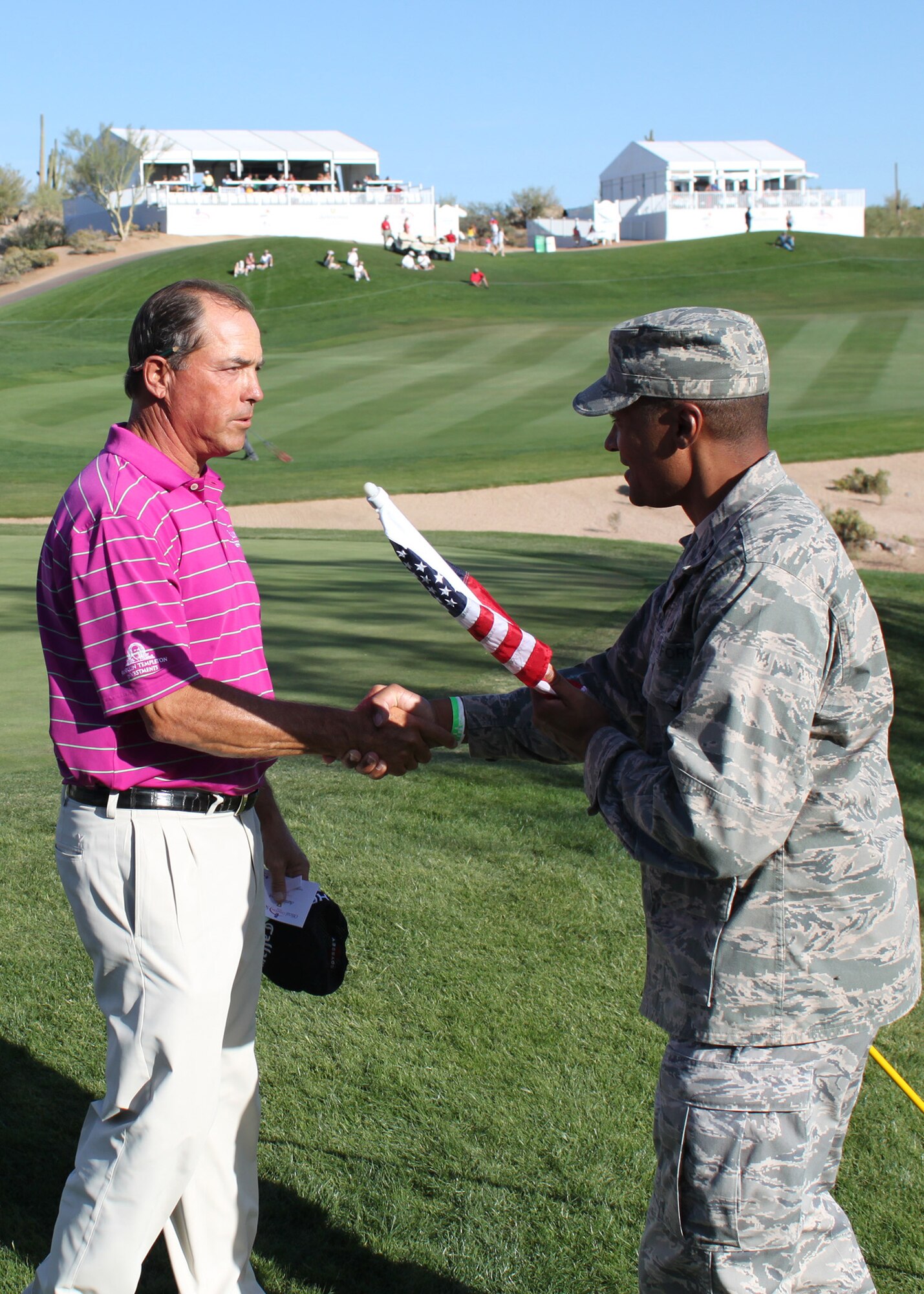 Olin Browne shakes Capt. Derrick Young's hand in appreciation for his military service during the Charles Schwab Cup Championship in Scottsdale, Ariz. Nov 4. (U.S. Air Force Photo by Tech. Sgt. Meredith Mingledorff) 