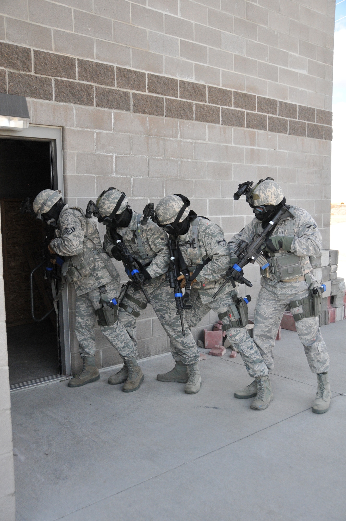 Members of the 153rd Security Forces Squadron participate in an active shooter training exercise Oct. 13, 2012. Training was part of the squadrons annual training program designed to prepare the SFS members for active shooter situations. (U.S. Air Force photo by Airman 1st Class Nichole Grady)
