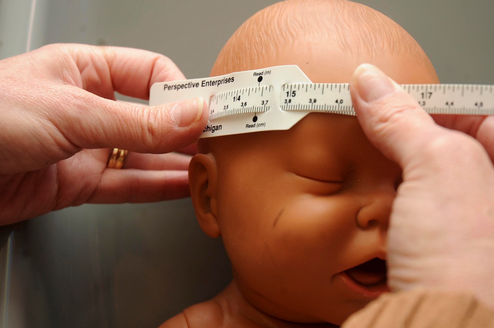 Linda Mirehouse, Women, Infants and Childrean dietitian, demonstrates how to properly measure the diameter of a baby’s head in the WIC office at Ellsworth Air Force Base, S.D., Nov. 1, 2012. One major type of nutrition risk that is recognized for WIC eligibility are medically-based risks such as anemia, underweight, overweight, history of pregnancy complications and poor pregnancy outcomes. (U.S. Air Force photo by Airman 1st Class Anania Tekurio/Released) 