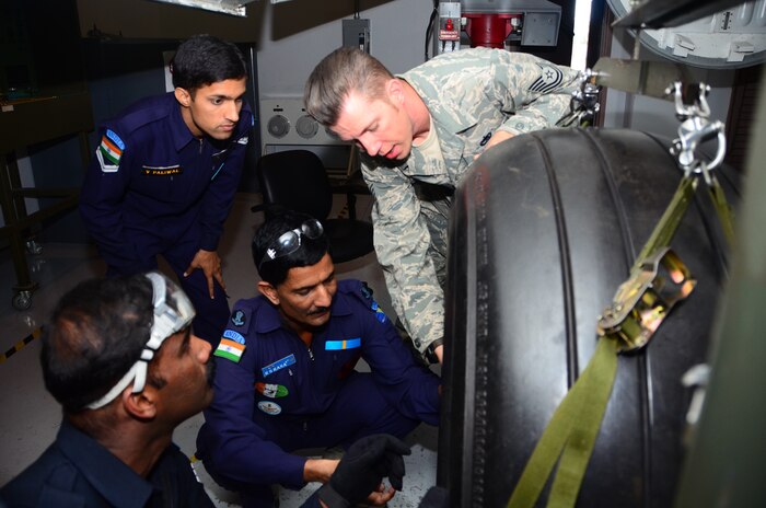 Tech. Sgt. Robert Barnhill, 373rd C-17 Globemaster III,  explains the procedure for changing a tire  to members of the Indian air force as the IAF members work through a simulated tire change Nov. 2, at Joint Base Charleston, S.C. The IAF expects to receive their 10 C-17s in June, 2013. In total, India paid $4.1 billion for 10 C-17s which is expected to replace the IAF IL-76 fleet. (U.S. Air Force photo/Senior Airman William O'Brien)