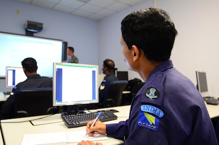 A student from the Indian Air Force takes notes during a lecture on the C-17 Globemaster III Nov. 1, at Joint Base Charleston, S.C. The training includes classroom time as well as hands-on work where the airmen apply the skills they learned in the classroom on simulation training aircraft. (U.S. Air Force photo/Senior Airman William O'Brien)