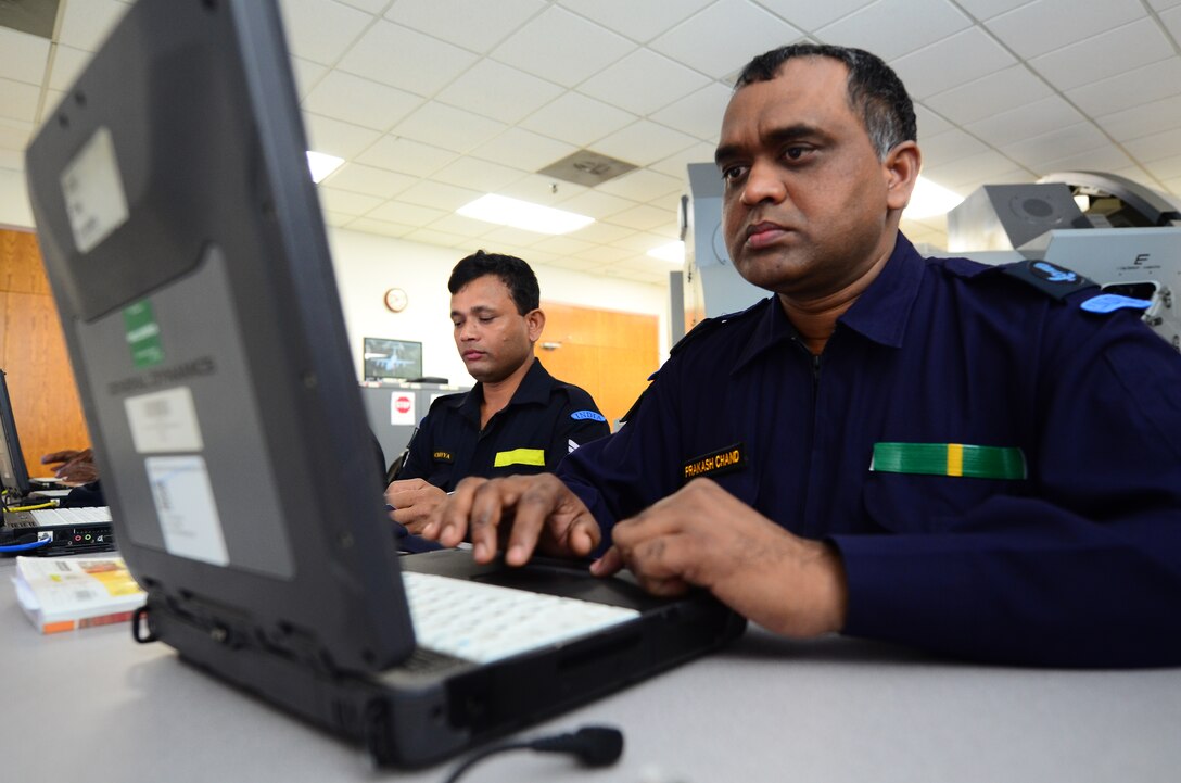 Indian air force Junior Warrant Officer Prakash Chand prepares to take part in a C-17 Globemaster III simulation by going over technical orders on a laptop Nov. 1, 2012, at Joint Base Charleston, S.C. IAF airmen are learning various aspects of the C-17 in groups of four students per class. The length of each class varies based on the specialty the students are learning. The courses last an average of four to six weeks. (U.S. Air Force photo/Senior Airman William O'Brien)
