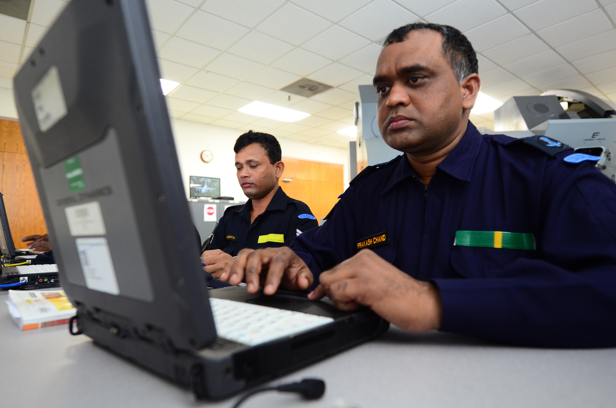 Indian air force Junior Warrant Officer Prakash Chand prepares to take part in a C-17 Globemaster III simulation by going over technical orders on a laptop Nov. 1, 2012, at Joint Base Charleston, S.C. IAF airmen are learning various aspects of the C-17 in groups of four students per class. The length of each class varies based on the specialty the students are learning. The courses last an average of four to six weeks. (U.S. Air Force photo/Senior Airman William O'Brien)
