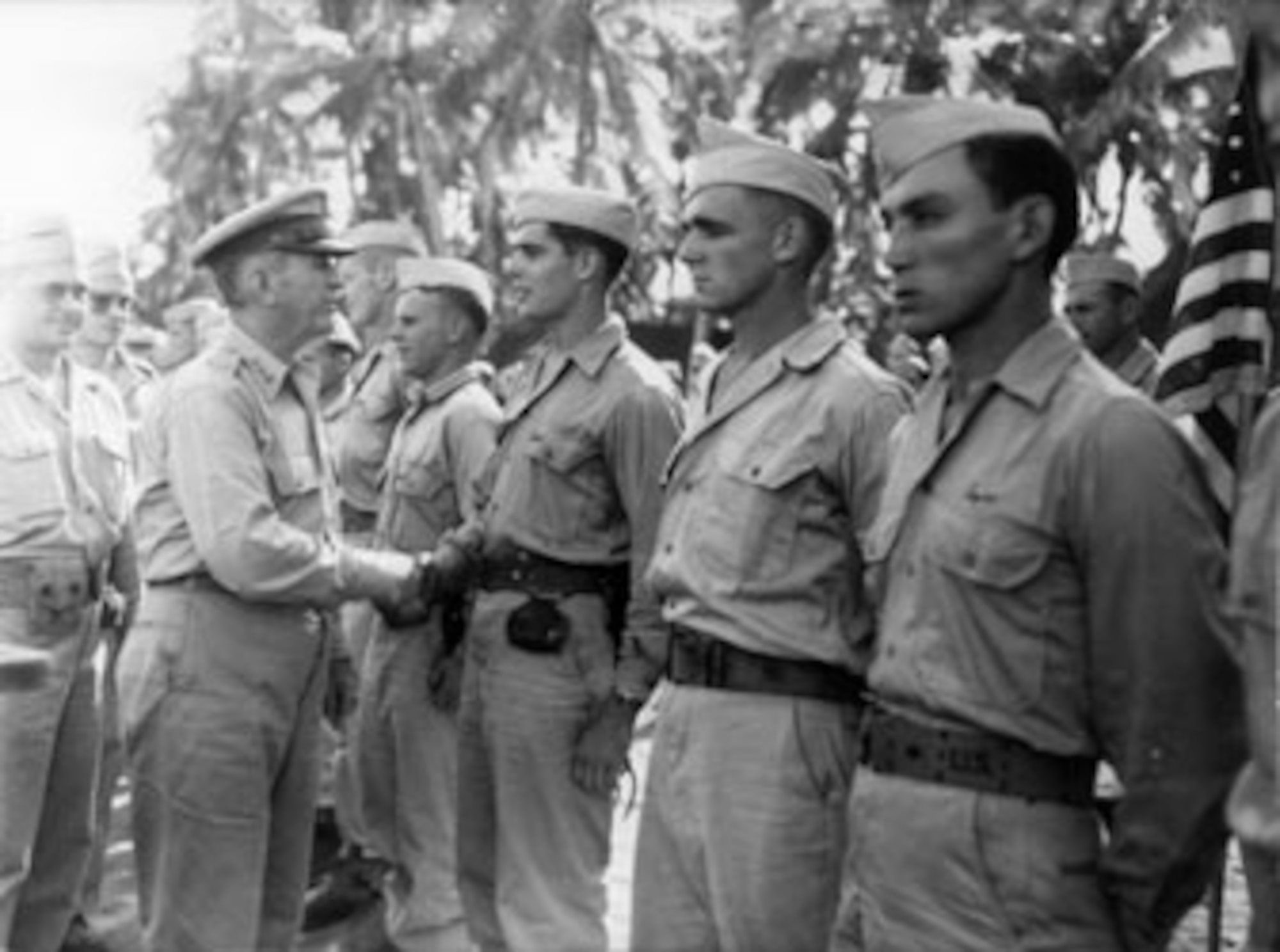 Lt. Gen. Walter Krueger, U.S. Sixth Army commanding general, congratulates Harry D. Weiland, an Alamo Scout, after awarding him the him the Bronze Star for Valor for a mission on Pegun Island in the Philippines. (Courtesy photo)
