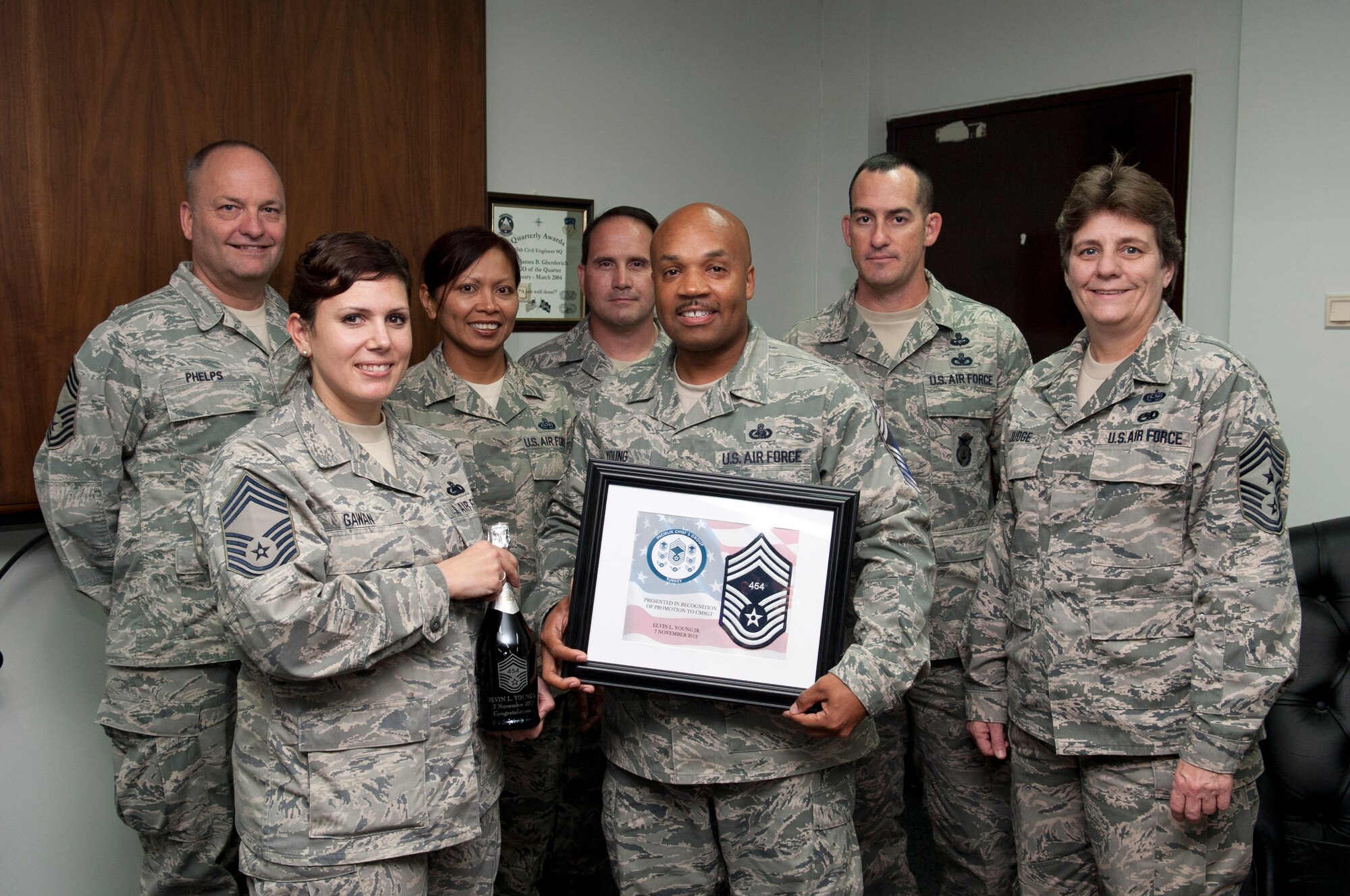 The Incirlik Chief's Group surprise Senior Master Sgt. Elvin Young, 39th Logistics Readiness Squadron, congratulating him on his line number for promotion to chief master sergeant Nov. 8, 2012, at Incirlik AB, Turkey. Elvin received line number 454, the final line number for promotion selection. (U.S. Air Force photo by Senior Airman Daniel Phelps/Released)
