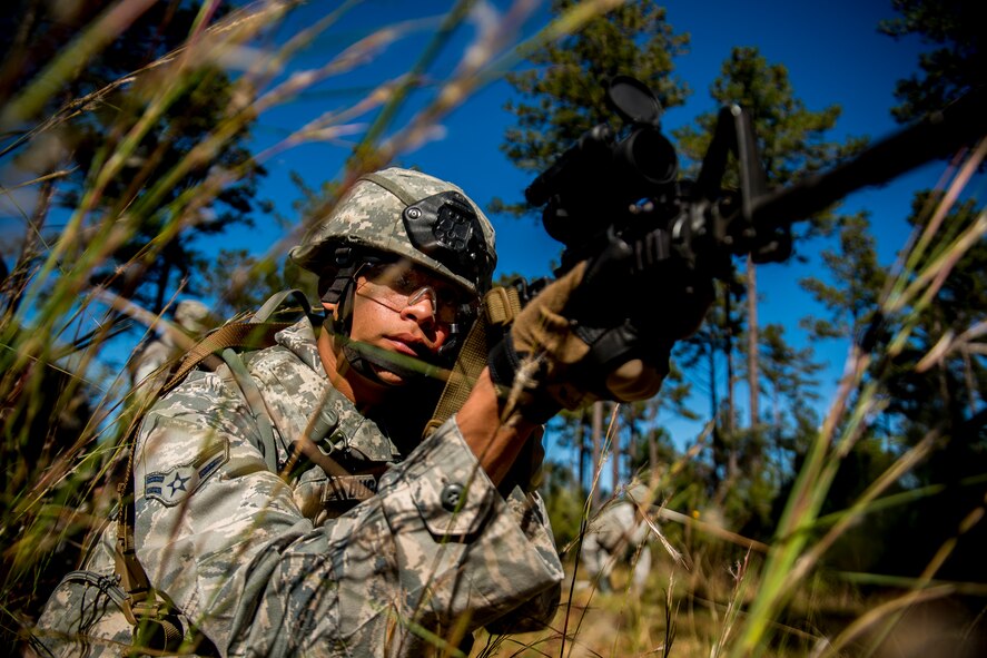 U.S. Air Force Airman 1st Class Patrick Dugan, 823d Base Defense Squadron fireteam member, aims an M-4 assault rifle during improvised explosive device lane training at Moody Air Force Base, Ga., Nov. 1, 2012. The 823d BDS regularly trains to maintain combat standards and is a unit ready to deploy at all times. (U.S. Air Force photo by Staff Sgt. Jamal D. Sutter/Released)