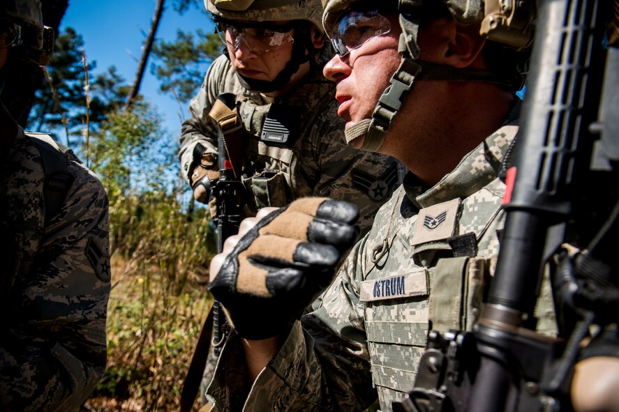U.S. Air Force Joseph Ostrum, 823d Base Defense Squadron alpha squad leader, communicates with his team during improvised explosive device lane training at Moody Air Force Base, Ga., Nov. 1, 2012. The unit conducted the training to stay current and proficient on ways to handle unforeseen IED threats in Afghanistan. (U.S. Air Force photo by Staff Sgt. Jamal D. Sutter/Released) 
