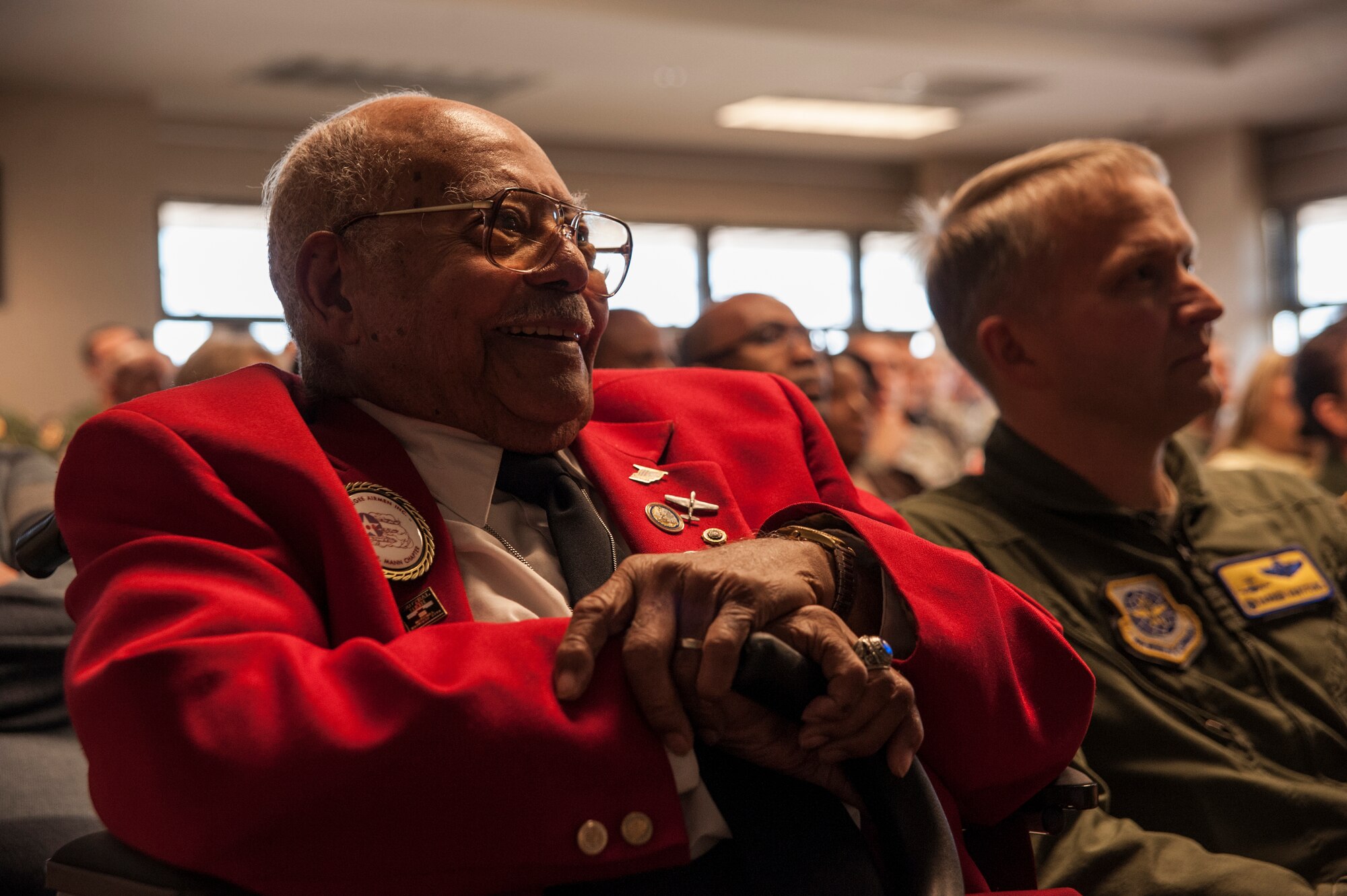 Tuskegee Airman, retired Lt. Col. Hiram Mann, visits the 16th Airlift Squadron Nov. 2, 2012, at Joint Base Charleston - Air Base, S.C. Entering the Army Air Corps as a pre-aviation student in 1942, Mann was assigned to the 100th Fighter Squadron of the 332nd Fighter Group, the Red Tail Angels, in Italy. During his career, Mann flew the P-40 "Warhawk" and the P-47 "Thunderbolt" fighter-type aircraft, and co-piloted the B-25 "Billy Mitchell" bomber, the C-47 "Gooney-bird" and the C-45 "Expediter” cargo planes. (U.S. Air Force photo/Airman 1st Class Ashlee Galloway)