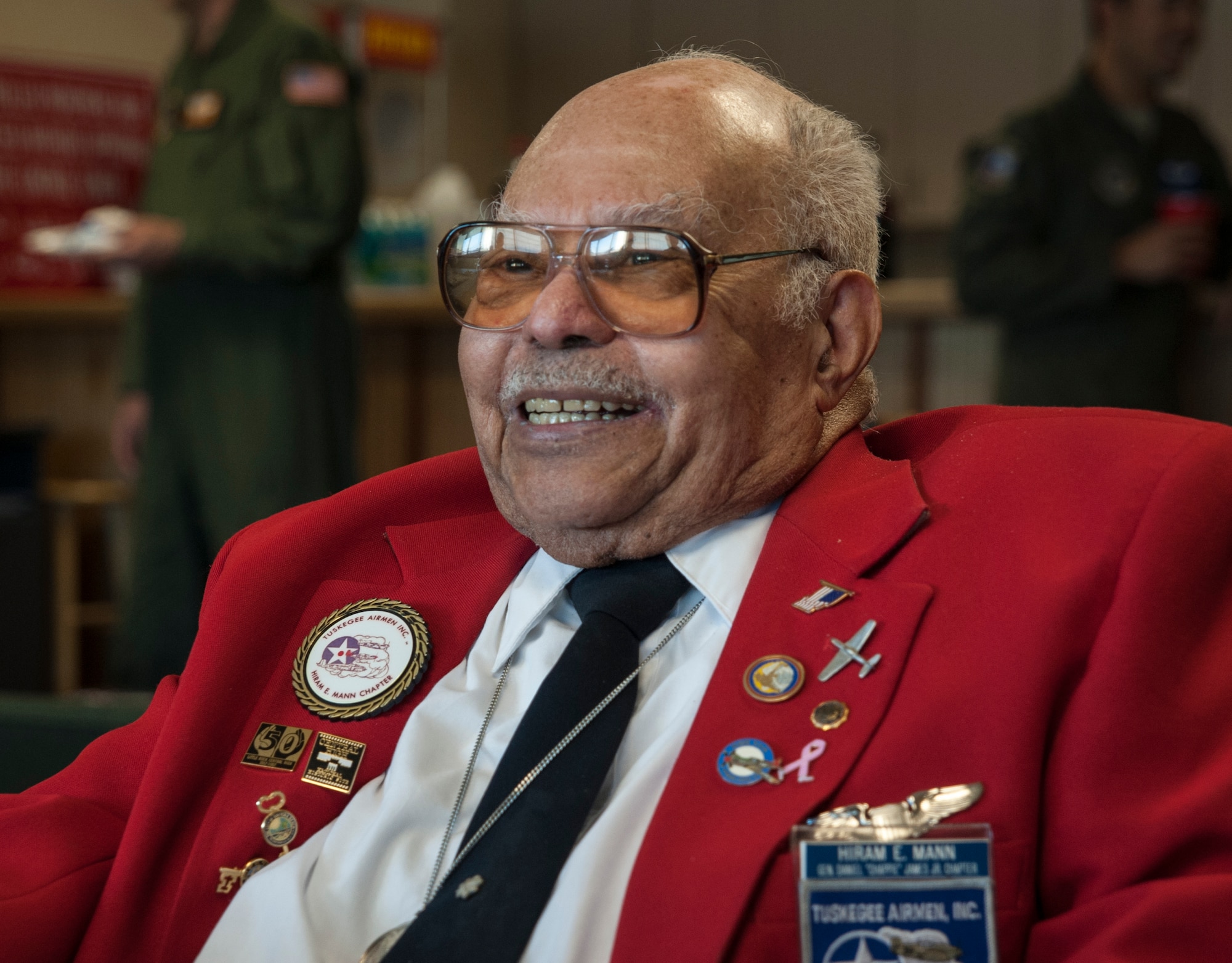 Tuskegee Airman, retired Lt. Col. Hiram Mann, visits the 16th Airlift Squadron Nov. 2, 2012 at Joint Base Charleston - Air Base, S.C. Entering the Army Air Corps as a pre-aviation student in 1942, Mann was assigned to the 100th Fighter Squadron of the 332nd Fighter Group, the Red Tail Angels, in Italy. During his career, Mann flew the P-40 "Warhawk" and the P-47 "Thunderbolt" fighter-type aircraft, and co-piloted the B-25 "Billy Mitchell" bomber, the C-47 "Gooney-bird" and the C-45 "Expediter” cargo planes. (U.S. Air Force photo/Airman 1st Class Ashlee Galloway)