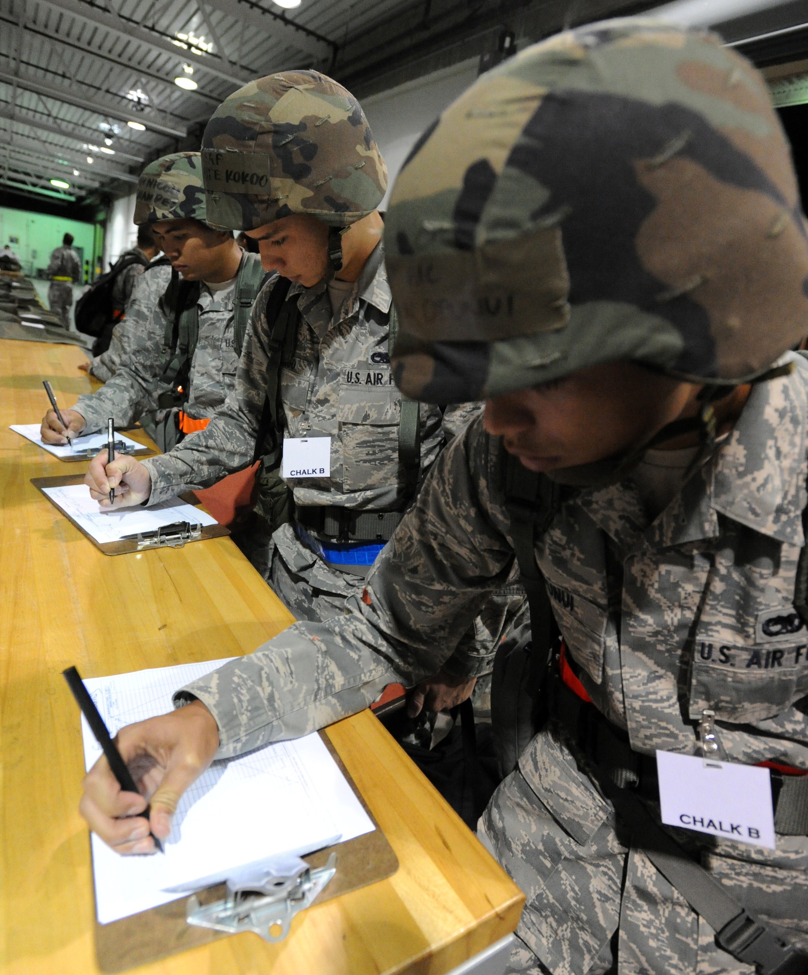 Airmen from the Hawaii Air National Guard process through a personnel deployment function line Nov. 7 during an exercise at Joint Base Pearl Harbor-Hickam, Hawaii. The PDF line tests the ability of Airmen to be medically, legally, administratively, spiritually, and financially ready to deploy, as well as the functionality of the processes in place with which to deploy them. (U.S. Air Force photo by Staff Sgt. Nathan Allen)