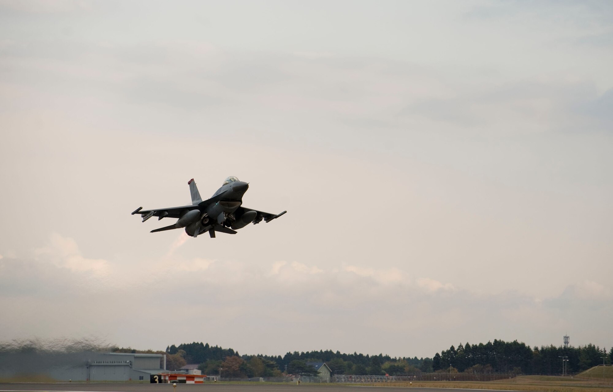 The last F-16 Fighting Falcon from the 35th Fighter Wing to receive full upgrades takes off Nov. 7, 2012 at Misawa Air Base, Japan. The 35th Aircraft Maintenance Squadron spent the past year configuring the wing’s entire F-16 fleet with the latest war-fighting capabilities, which include a new internal navigation system, avionics program and an on-board oxygen generating system. (U.S. Air Force photo by Staff Sgt. Jess Lockoski)