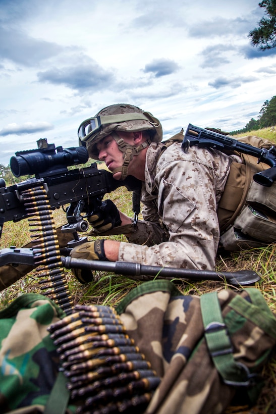A Marine provides security with an M249 squad automatic weapon during a tactical aircraft and personnel recovery mission on Camp Lejeune, N.C., Oct. 30, 2012.