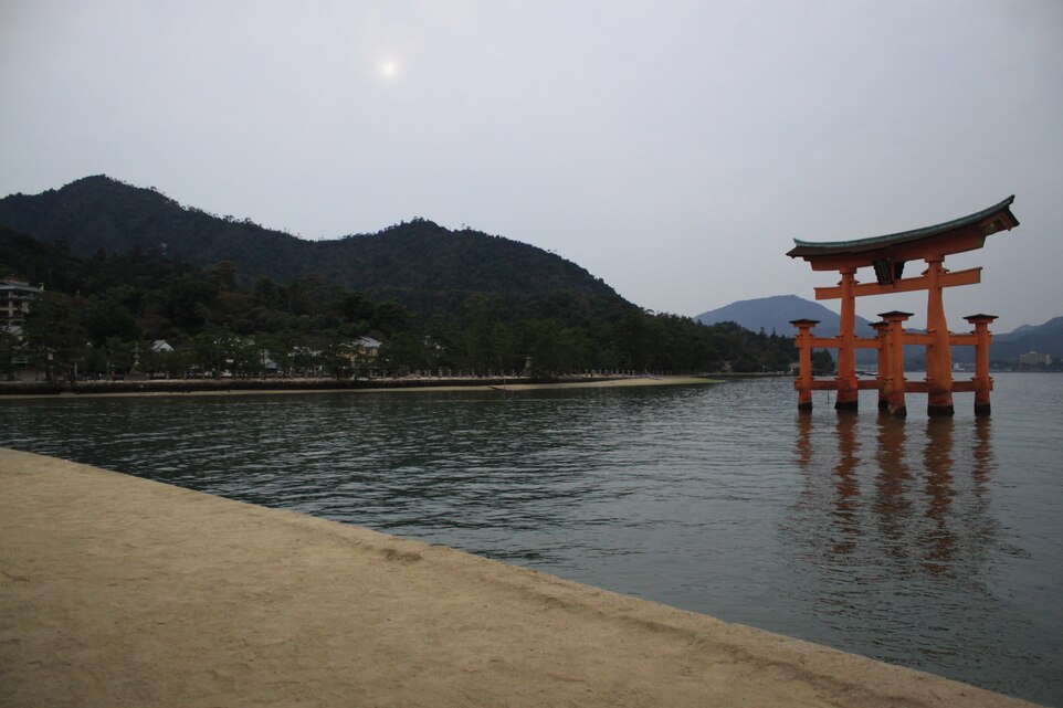 A torii gate rests steadfast in the sea off the coast of Itsukushima, Nov. 4, 2012. In days gone by, pilgrims and those wanting to approach the shrine had to steer their vessels through the torii gate.