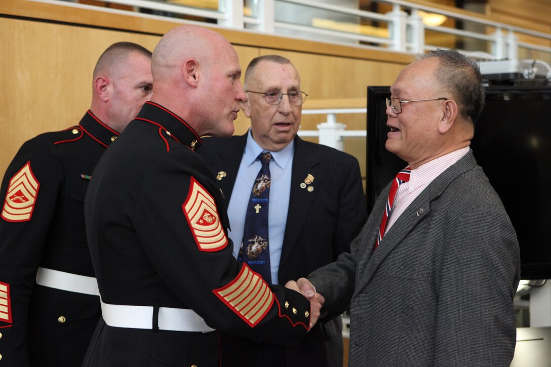 Sgt. Maj. Micheal P. Barrett, the 17th Sergeant Major of the Marine Corps, participates in a Cake Cutting Ceremony at Navy Federal Credit Union Headquarters in Vienna, Va., Nov. 6, 2012. (U.S. Marine Corps photo by Cpl. Cody A. Fodale)