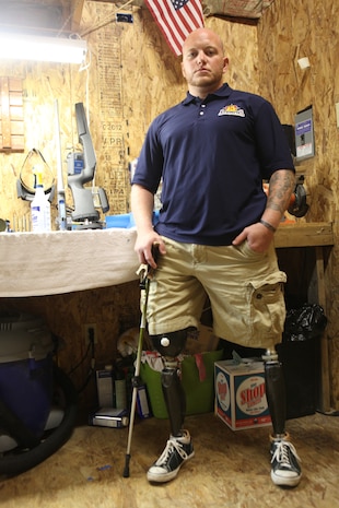 Retired Staff Sgt. Brad M. Lang, who was a technician with 2nd Explosive Ordnance Disposal Company, 2nd Marine Logistics Group, stands in his workshop in Jacksonville, N.C., Oct. 26, 2012. Lang lost both of his legs when an improvised explosive device detonated in Afghanistan in 2011 and now runs his own business. 