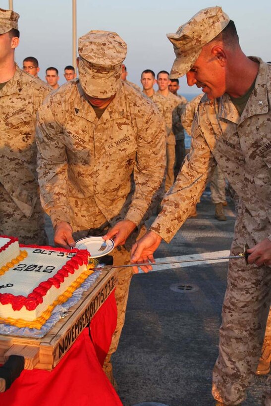 Lieutenant Col. John J. Wiener, commanding officer, Combat Logistics Battalion 15, 15th Marine Expeditionary Unit, slices a piece of cake during an early Marine Corps Birthday celebration on the flight deck of the USS Rushmore, Nov. 7. The 15th MEU is deployed as part of the Peleliu Amphibious Ready Group as a theater reserve and crisis response force throughout U.S. Central Command and the U.S. 5th Fleet area of responsibility.