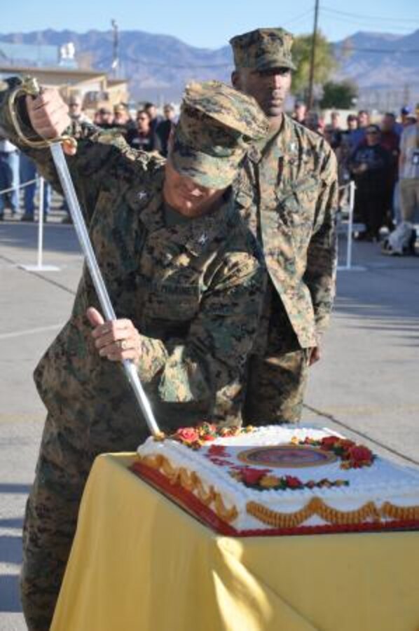 Colonel Stephen Medeiros, commanding
officer of Marine Depot Maintenance Command, cuts the first slice of cake with a noncommissioned officers' sword for the oldest Marine present, Nov. 6. It is a Marine Corps birthday tradition for the oldest and youngest Marine present to share the first piece of cake.


