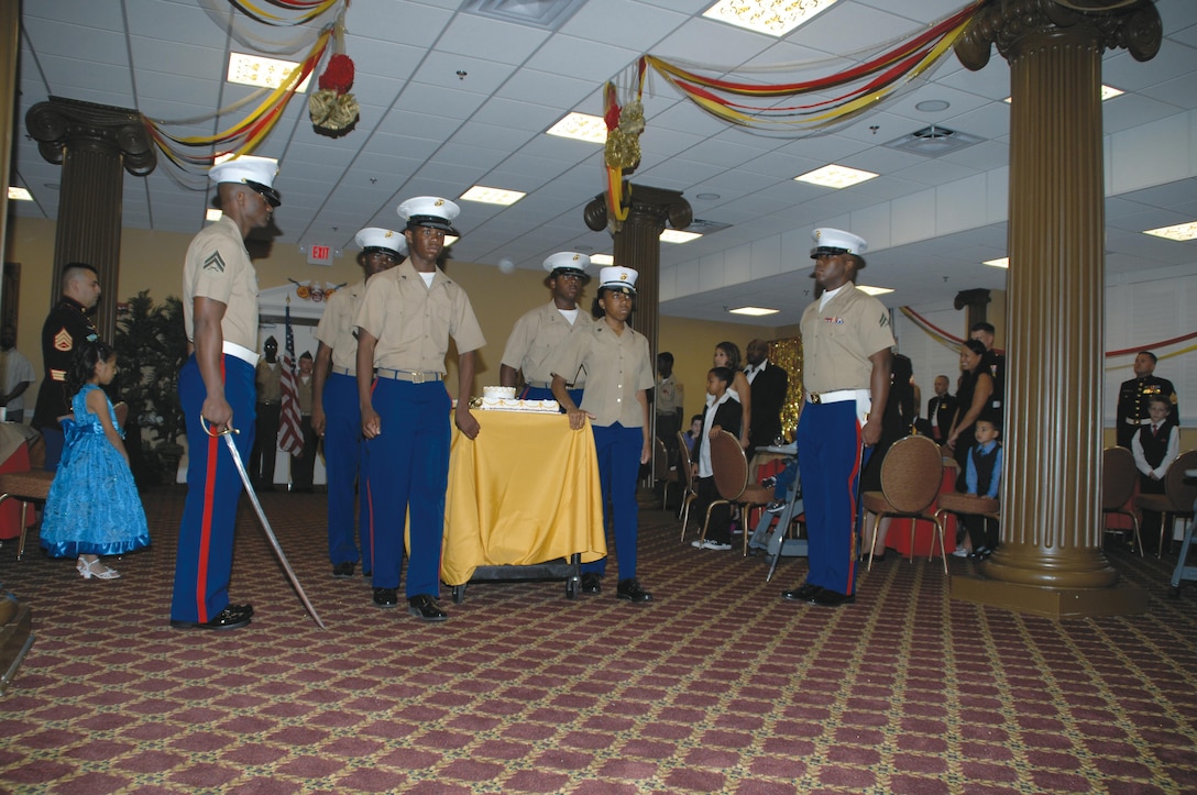 Dougherty County High School Marine Corps Junior Reserves Officers’ Training Corps cadets escort the Marine Corps birthday cake during the Kids’ Marine Corps Birthday Ball at Marine Corps Logistics Base Albany, Nov. 3.