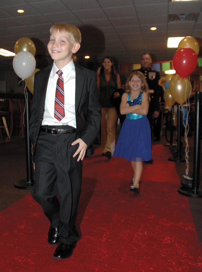 Children dressed in suits and ties, ball gowns and tuxedos were seen strutting their stuff on the red carpet like celebrities as they entered the Town and Country Restaurant’s Grand Ballroom, Nov. 3.
About 150 people, 72 of them children ages   2 - 14, attended the first-time Kids’ Marine Corps Birthday Ball at Marine Corps Logistics Base Albany.
