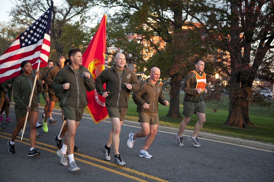 Sergeant Major of the Marine Corps Micheal Barrett leads Marines during the Headquarters Marine Corps Birthday Run to the Marine Corps War Memorial Nov. 9. The run commemorated the 237th Marine Corps birthday and featured Assistant Secretary of the Navy Juan M. Garcia as the keynote speaker.