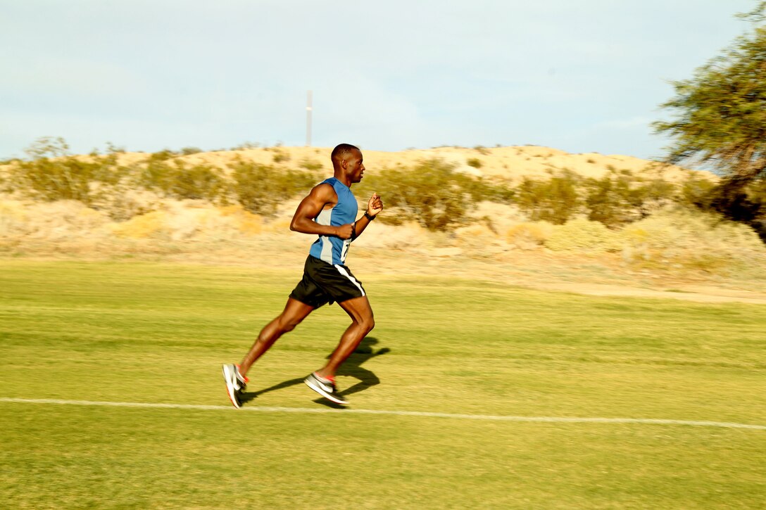 Staff Sgt. Arold Sylvain, motor transport chief, Marine Unmanned Aerial Vehicle Squadron 3 is out in the lead of the race. Sylvain won the race with a time of 36:40.