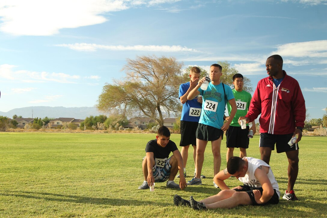 The VMU-3 team stretches after completing the six-mile race at the Desert Winds Golf Course Nov. 1.