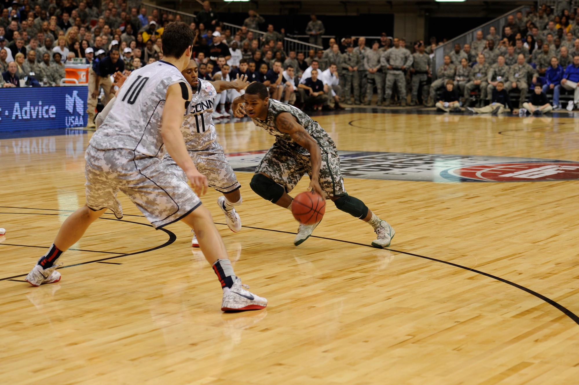 Kieth Appling, Michigan State University point guard, sprints for the hoop during the 2012 Armed Forces Classic on Ramstein Air Base, Germany, Nov. 10, 2012. The match-up between MSU and University of Connecticut is part of ESPN's Veteran's week initiative to honor the men and women who have served and are still serving in the U.S. military. (U.S. Air Force photo/Senior Airman Aaron-Forrest Wainwright)