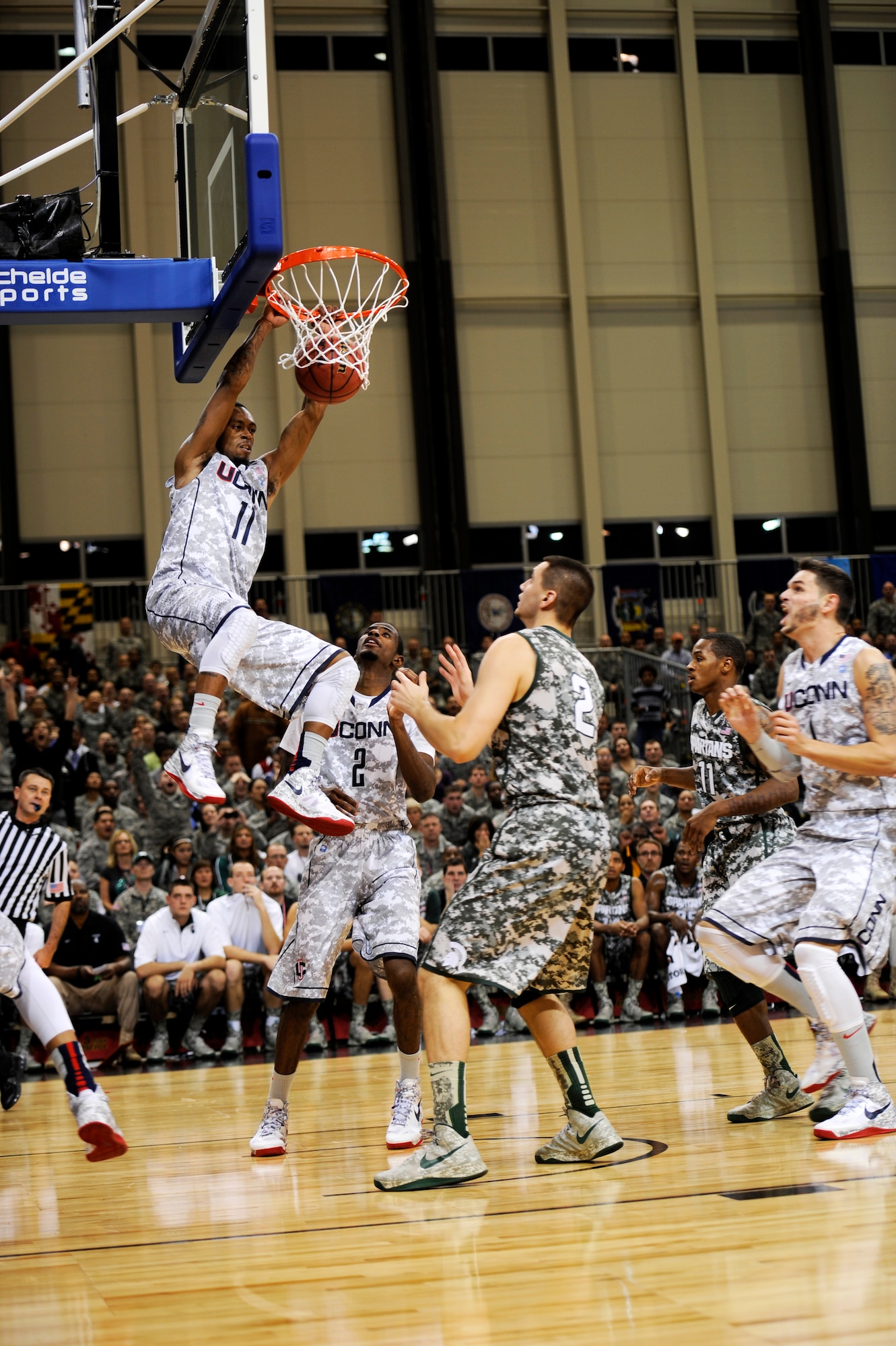 Ryan Boatright, University of Connecticut point guard, dunks during the 2012 Armed Forces Classic on Ramstein Air Base, Germany, Nov. 10, 2012. The match-up between Michigan State University and UCONN is part of ESPN's Veteran's week initiative to honor the men and women who have served and are still serving in the U.S. military. (U.S. Air Force photo/Senior Airman Aaron-Forrest Wainwright)
