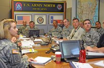 Lt. Gen. William Caldwell IV (center), commanding general, U.S. Army North and senior commander, Fort Sam Houston and Camp Bullis, listens as his staff briefs him at the Combined Operations and Integration Center conference room on the Department of Defense’s ongoing response to Hurricane Sandy relief
efforts.
Photo by Luis Deya, Army