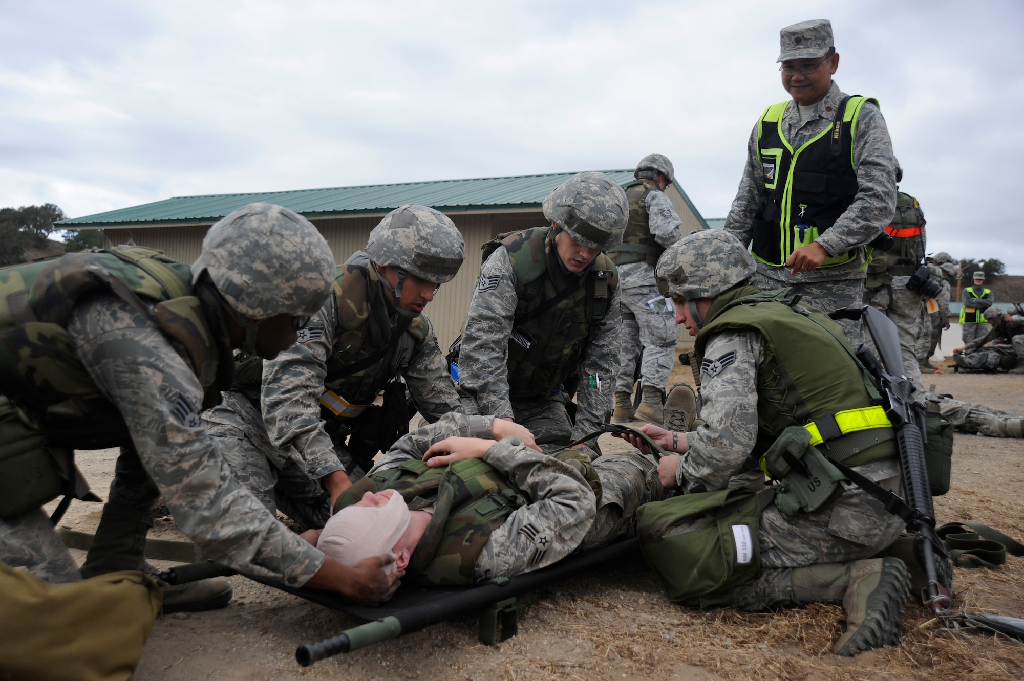 VANDENBERG AIR FORCE BASE, Calif. -- Team V members prepare a wounded Airman for transport after a simulated attack during a Northstar exercise here Thursday, Nov. 8, 2012. The Northstar exercise is designed to test the deployment capabilities and combat survival skills of Vandenberg Airmen.(U.S. Air Force photo/Michael Peterson)