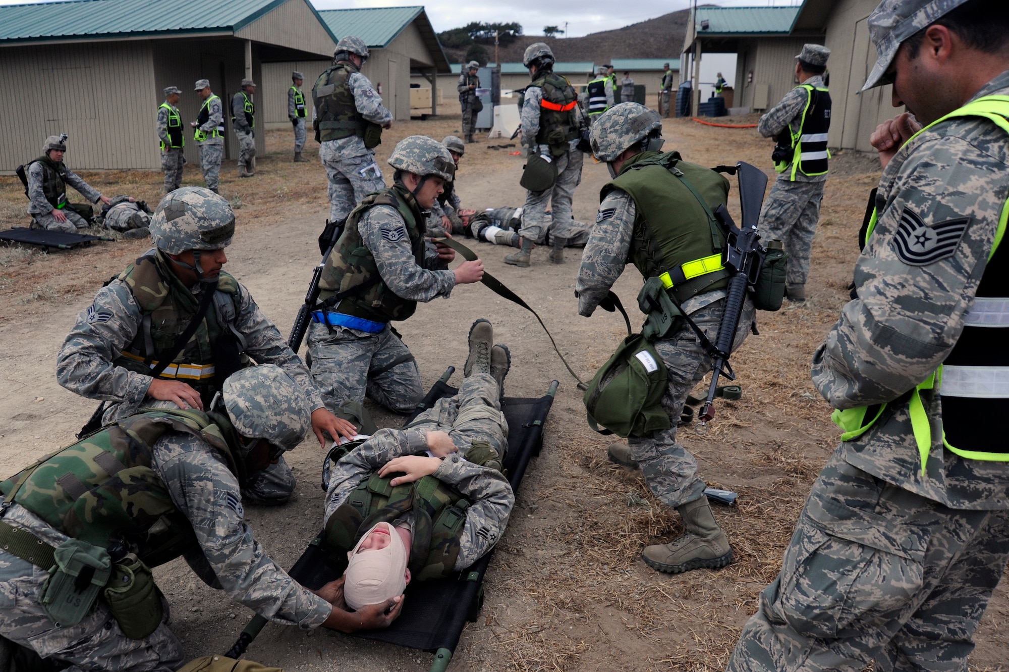 VANDENBERG AIR FORCE BASE, Calif. -- Vandenberg Airmen work to identify and stabilize the wounded after a simulated attack during a Northstar exercise here Thursday, Nov. 8, 2012. The Northstar exercise is designed to test the deployment capabilities and combat survival skills of Vandenberg Airmen. (U.S. Air Force photo/Michael Peterson)