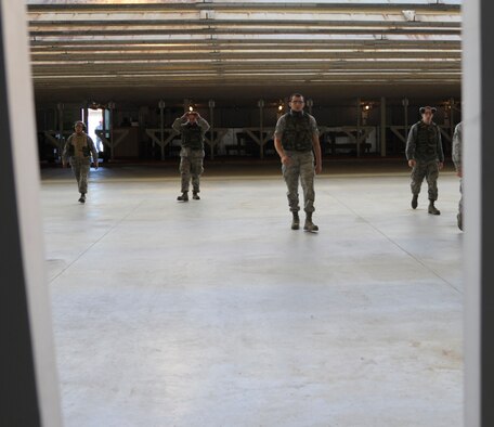 Airmen walk to their during combat arms training and maintenance qualification course at Whiteman Air Force Base, Mo., Nov. 1. This class was the first to shoot at the range since it went through recent renovations; adding sound barriers to the baffling, new target holders and a new bullet trap and ventilation system. (U.S. Air Force photo/Senior Airman Cody H. Ramirez) (Released)