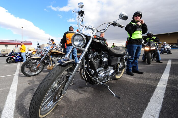 Tech. Sgt. Michael Shannon, 820th RED HORSE pavements and construction craftsman, puts his helmet on during a motorcycle safety course hosted by the 820th RED HORSE squadron Nov. 09, 2012, at Nellis Air Force Base, Nev. Helmet laws vary from sate to state, but all Airmen are required to wear a helmet when operating or riding on a motorcycle.  (U.S. Air Force photo by Staff Sgt. William P. Coleman)
  

