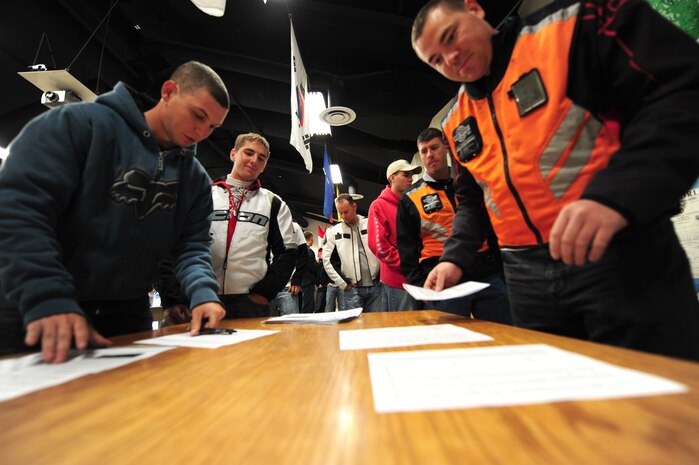 Airmen and civilian motorcycle riders sign in for a motorcycle mentorship safety course hosted by the 820th RED HORSE squadron Nov. 09, 2012, at Nellis Air Force Base, Nev. The U.S. Air Force mandates that all motorcycle riders take a refresher safety course every three years.  (U.S. Air Force photo by Staff Sgt. William P. Coleman)
  

