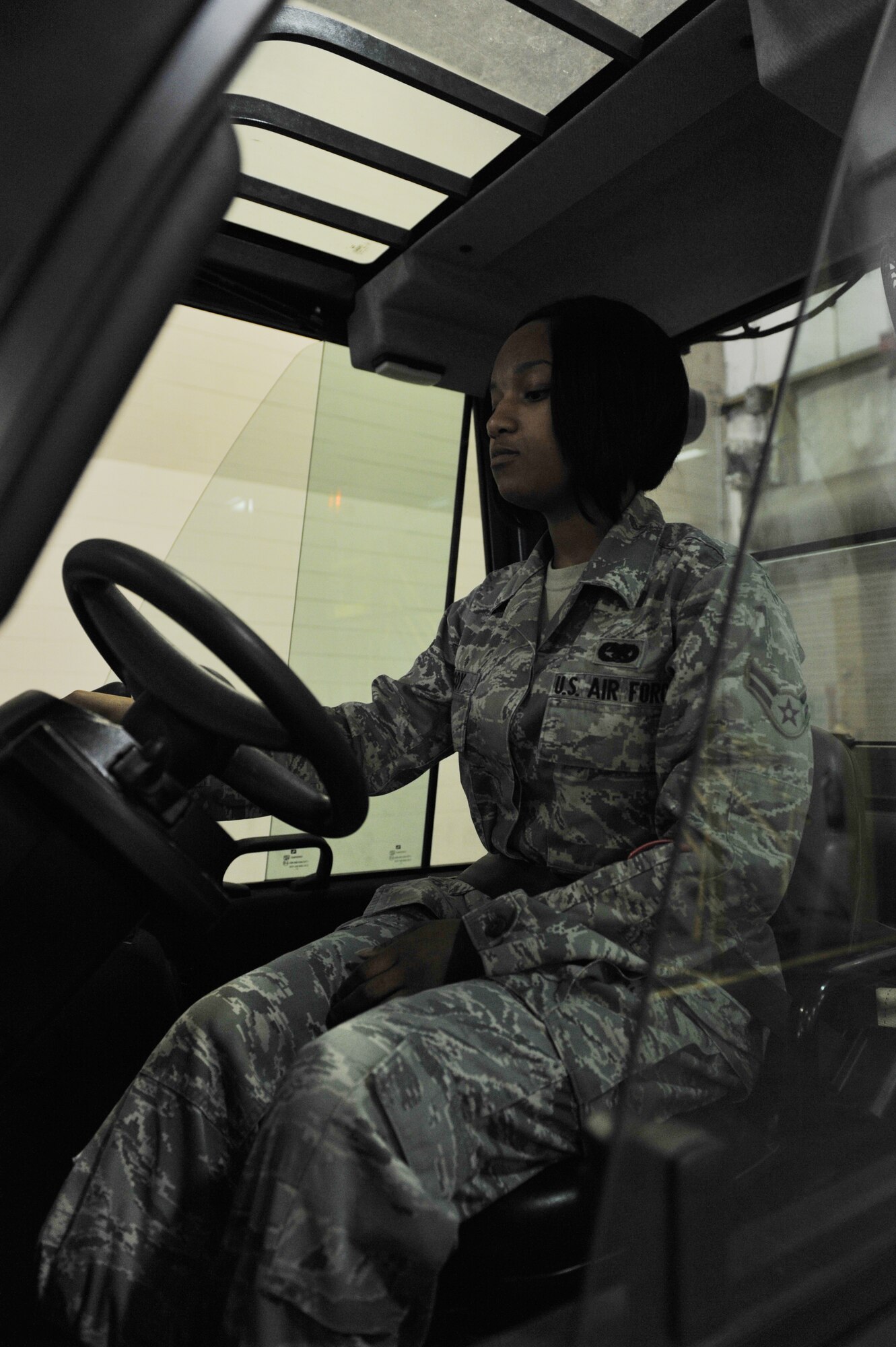 Senior Airman Marita McCoy, 509th Logistics Readiness Squadron in-bound cargo receiving clerk, operates a fork lift during her shift at Whiteman Air Force Base, Mo., Oct. 1, 2012. McCoy was stationed at the 376th Logistics Readiness Squadron cargo movement as the weapons monitor from Jan. 11, 2012 to July 22, 2012, and dealt with all the weapons that came through the base (U.S. Air Force photo/Heidi Hunt) (Released)