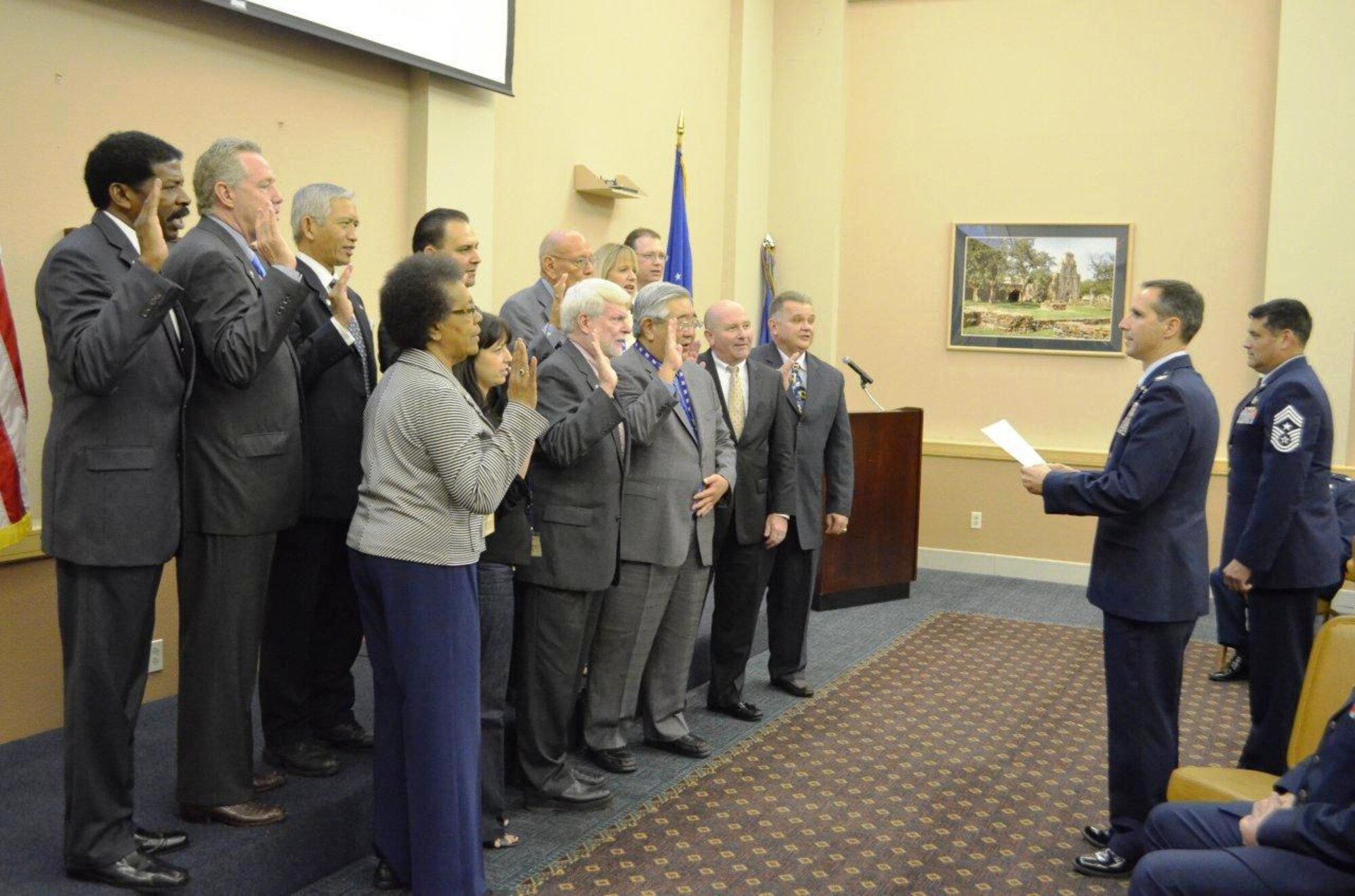 433rd Airlift Wing Honorary Commanders take the Honorary Commander's Oath during an induction ceremony Nov. 3 at Joint Base San Antonio-Lackland. The Honorary Commanders’ program encourages an exchange of ideas, practices and bonds with local business and community leaders (U.S. Air Force photo by SMSgt Minnie Jones)