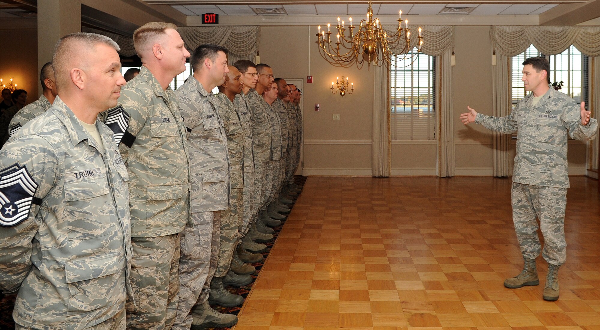 U.S. Air Force Col. Korvin Auch, right, 633rd Air Base Wing commander, congratulates the newly selected chief master sergeants during a promotion-release ceremony at Langley Air Force Base, Va., Nov. 8, 2012.  Chief master sergeants are key leaders at all levels, from flight to Air Staff, in the Air Force. (U.S. Air Force photo by Senior Airman Racheal E. Watson/Released)