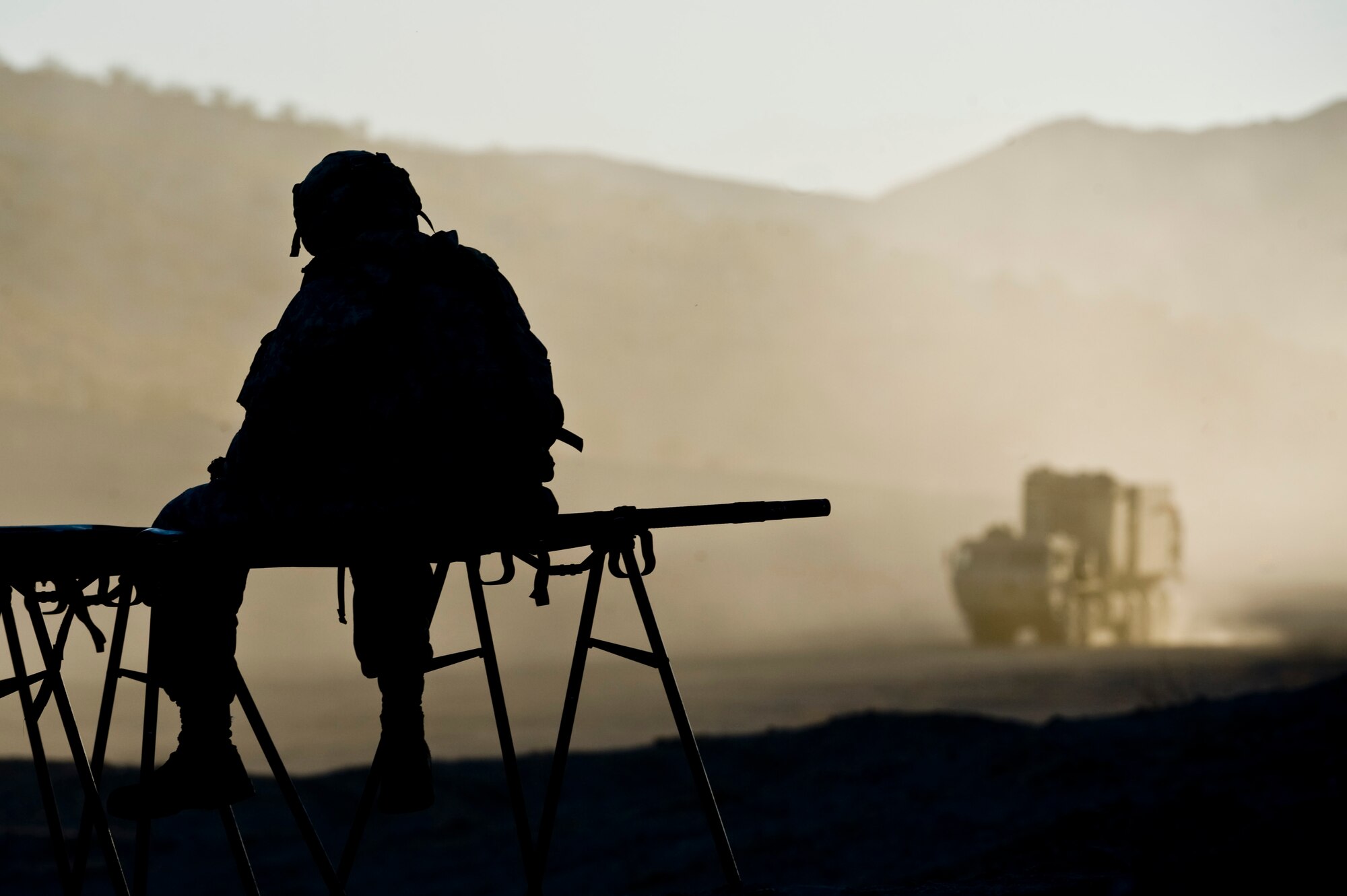 A soldier looks on as reinforcements come arrive with supplies during Green Flag-West 13-2 Nov. 7, 2012, at the National Training Center at Fort Irwin, Calif. The NTC holds exercises like this monthly to give our military a simulated version of possible real-world combat scenarios. (U.S. Air Force Photo by Senior Airman Daniel Hughes)
