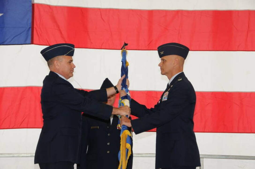 Brig. Gen. James Schroeder, Illinois Air National Guard commander, passes
the wing flag to Col. Ronald E. Paul, incoming 183rd Fighter Wing commander,
during a change of command ceremony in Springfield Nov. 3.  Prior to
assuming command, Colonel Paul was the Director of Logistics on the
Continental U.S. North American Aerospace Defense Command Region - 1st Air
Force (Air Forces Northern) staff. The passing of the flag symbolizes the
passing of command responsibilities to the new commander.  
