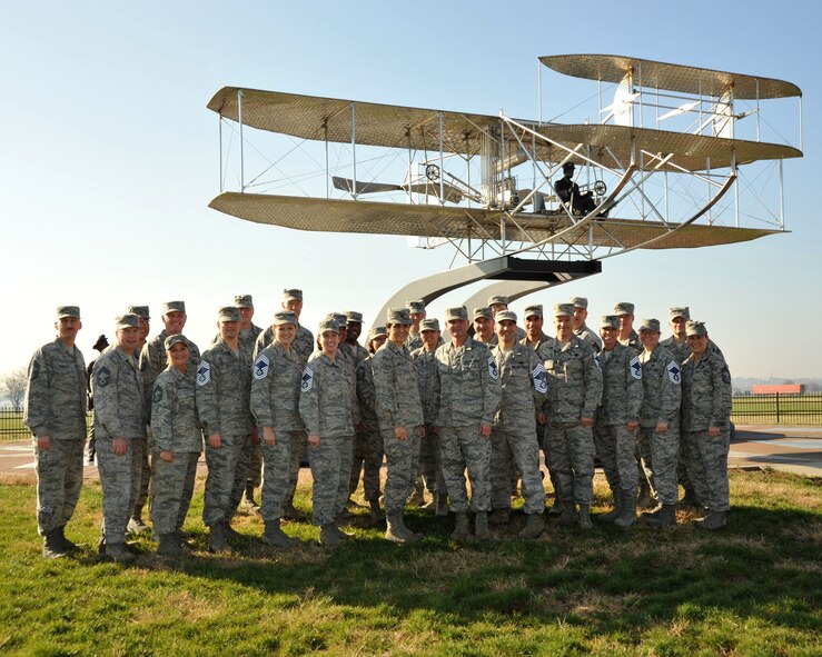 WPAFB Chiefs Group, Col. Cassie Barlow, 88th Air Base Wing commander, and the newly promoted Chief Master Sergeants by the Wright B Flyer on Area B.  (photo by Michelle Gigante) 