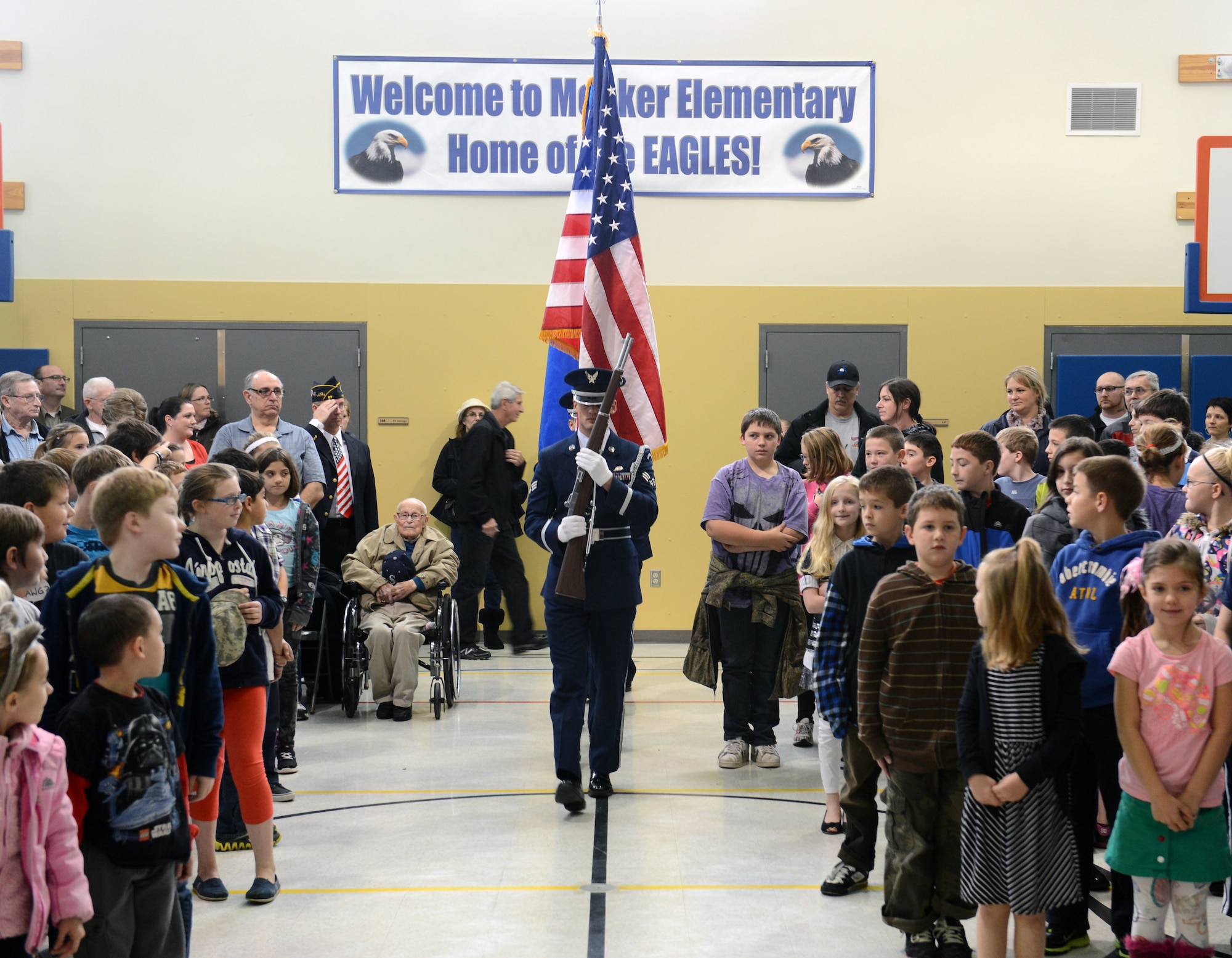 Members of the McChord Field Honor Guard assigned to Joint Base Lewis-McChord, Wash., present the colors at the Meeker Elementary School Veterans Day assembly, Nov. 8, 2012 at Puyallup, Wash. The base honor guard supported this event with a posting and retiring of the colors for the more than 400 students of the school. (U.S. Air Force photo/Master Sgt. Todd Wivell)