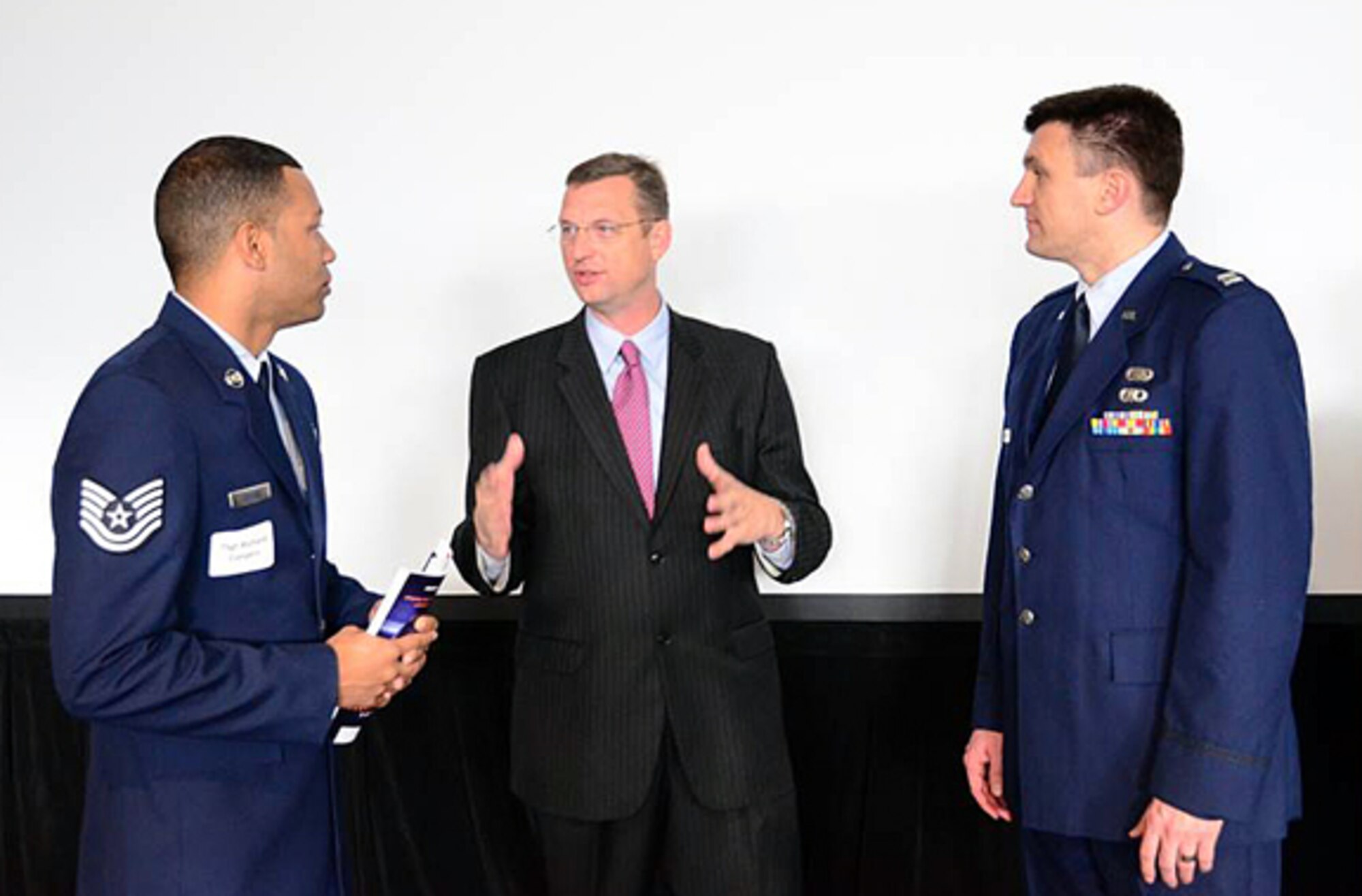 Congressman-elect Collins speaks with Capt. Patrick Simmons, 94th Airlift Wing public affairs officer, and Tech. Sgt. Richard Conyers, 94th Airlift Wing interim equal opportunity director, at  the Georgia Jobs for Veterans Employer Breakfast at the Georgia World Congress Center, Nov. 8. Collins is also a traditional reservist at Dobbins Air Reserve Base, where he serves as the base chaplain. (U.S. Air Force photo/Senior Airman Elizabeth Van Patten)