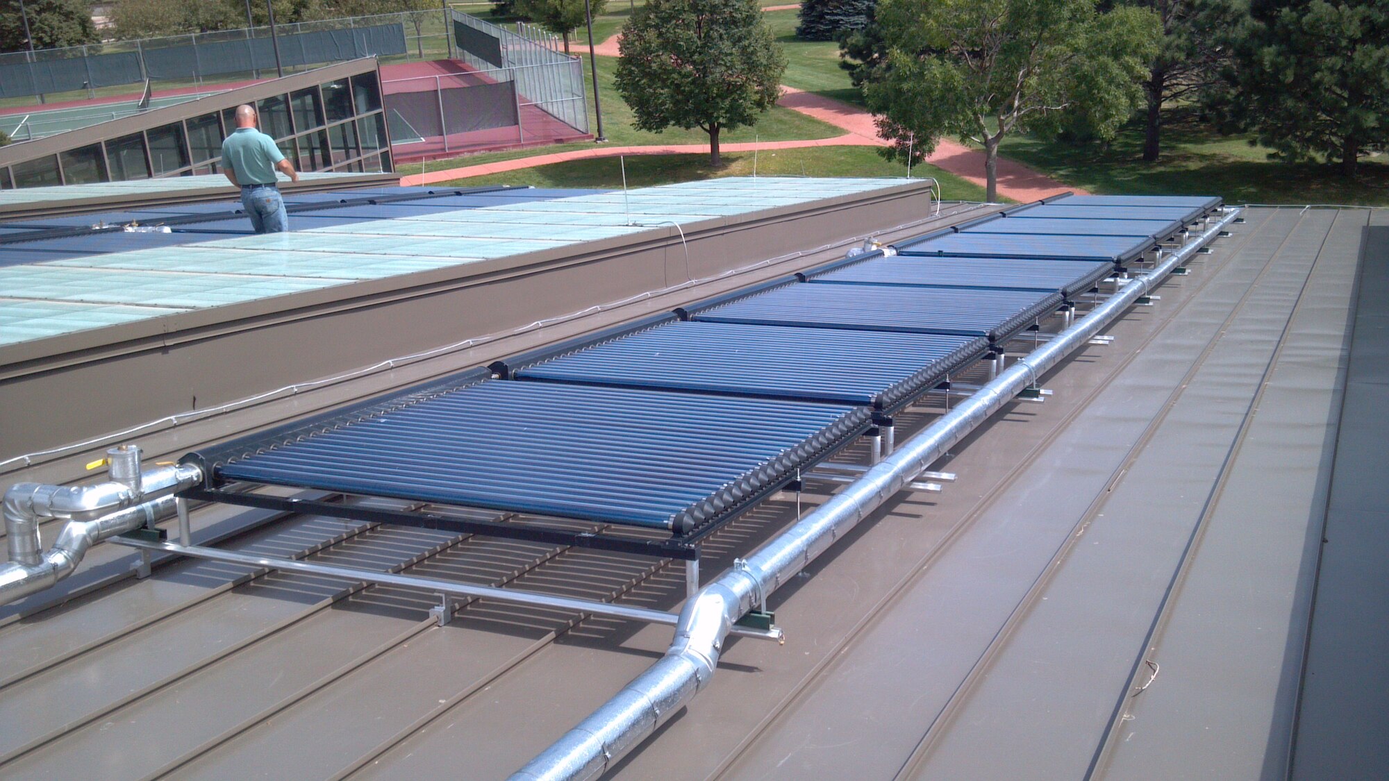 The 21st Civil Engineer Squadron installed 24 solar panels at the Peterson Aquatics Center to help heat the approximately 225,000 gallons of water in the pool. The solar panels and other efficiencies have helped reduce energy consumption at the pool by 60 percent. (U.S. Air Force photo)
