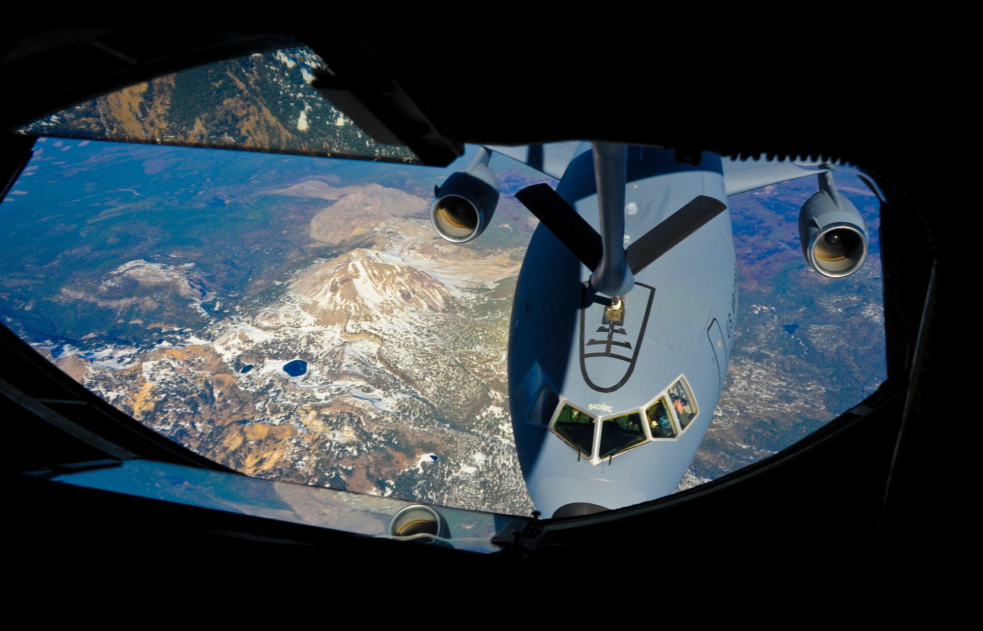 A KC-10 Extender from the 60th Air Mobility Wing at Travis Air Force Base, Calif., refuels from a 93rd Air Refueling Squadron’s KC-135 Stratotanker during a spouses orientation flight over Washington and Oregon Nov. 7, 2012. Fairchild spouses flew as part of an ongoing program designed to orient them with what it means to be an Airman here. Participants wore their respective husband’s flight suits adding to the overall realness of the experience. (U.S. Air Force photo by Senior Airman Benjamin Stratton)