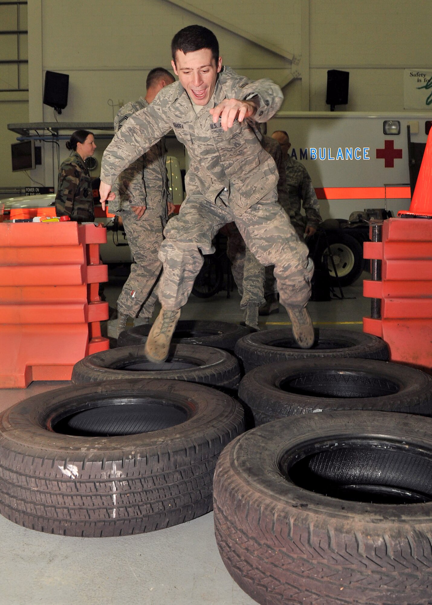 Airman 1st Class Dustin Ybarra, from the 100th Maintenance Squadron, runs through the obstacle course during the RAF Mildenhall Combat Dining out in Hangar 814, Nov. 9, 2012, at RAF Mildenhall, England. The event was sponsored by Team Mildenhall’s Top 3 and served as a morale-building event open to all enlisted Airmen on base. (U.S. Air Force photo by Senior Airman Jerilyn Quintanilla/Released)