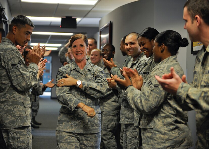 U.S. Air Force Senior Master Sgt. Gina Thursby, Senior Airman Jason D. Cunningham Airmen Leadership School commandant, receives applause from her ALS students after finding out she made the rank of chief master sergeant Nov. 8, 2012, at Moody Air Force Base, Ga. Col. Billy Thompson, 23d Wing commander, and Chief Master Sgt. Frank Batten, 23d WG command chief, broke the news to her along with other base group commanders and chiefs. (U.S. Air Force photo by Senior Airman Eileen Meier/Released) 