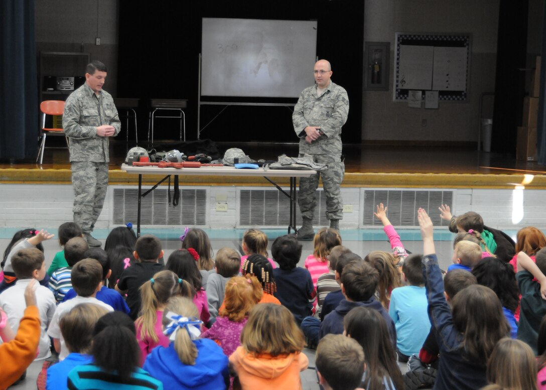 YOUNGSTOWN AIR RESERVE STATION, Ohio--U.S. Air Force Staff Sgts. Brian Willaman and Arlon Johnson, both 910th Airlift Wing Security Forces members, answer questions from students at Poland North Elementary School. The Security Forces members gave a presentation for the students Nov. 9, 2012, as part of a Veterans Day program. U.S. Air Force photo by Mr. Eric M. White.