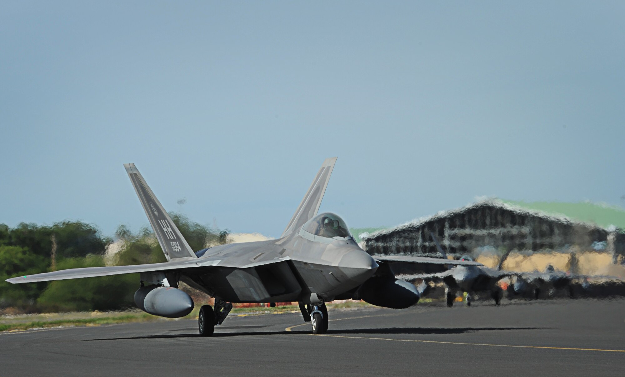 F-22 Raptors taxi for takeoff from Joint Base Pearl Harbor-Hickam, Hawaii, during an Initial Operational Capability (IOC) certification Nov. 8. The F-22 Raptor is the Air Force's newest fighter aircraft. Its combination of stealth, super-cruise, maneuverability, and integrated avionics, coupled with improved supportability, represents an exponential leap in war fighting capabilities. (U.S. Air Force photo/Senior Airman Lauren Main)