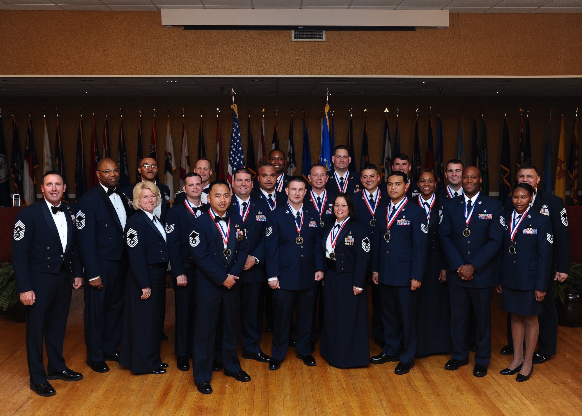 Sixteen Airmen were inducted as senior non-commissioned officers on Nov. 1 at the Columbus Club, joining them in the photo are the 14th Flying Training Wing group chief master sergeants, 14th FTW commander and the guest speaker Chief Master Sgt. Lonnie Slater Air University command chief master sergeant. (U.S. Air Force photo/Senior Airman Chase Hedrick)